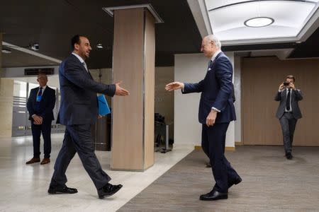 UN Special Envoy for Syria Staffan de Mistura (R) shakes hands with Syria's main opposition High Negotiations Committee (HNC) leader Nasr al-Hariri upon his arrival for a meeting during Syria peace talks in Geneva, Switzerland, February 27, 2017. REUTERS/ Fabrice Coffrini/Pool