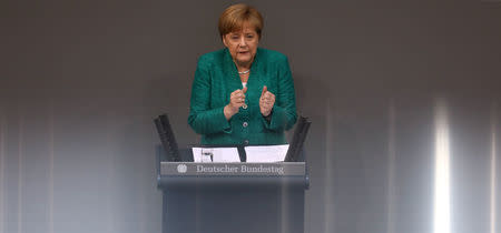 German Chancellor Angela Merkel addresses the German lower house of parliament Bundestag in Berlin, Germany, June 28, 2018. REUTERS/Christian Mang