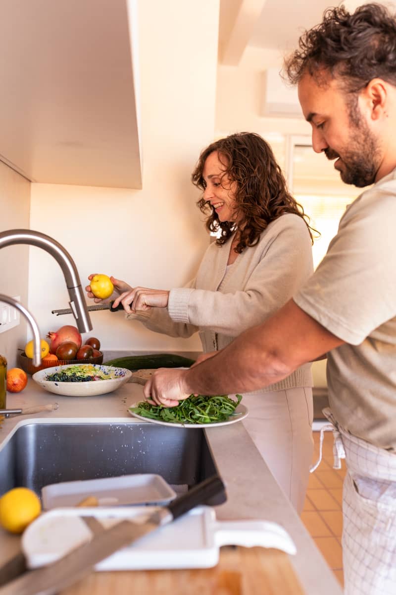 Couple making dinner together.