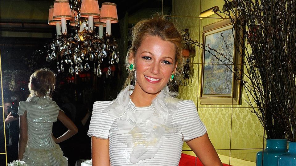 Blake Lively in a ruffled white mini dress