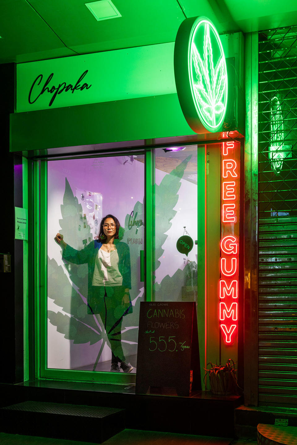 Chokwan “Kitty” Chopaka poses inside her cannabis dispensary on Bangkok’s Sukhumvit Road<span class="copyright">Cedric Arnold for TIME</span>