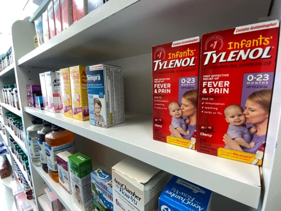 Pharmacies across Canada are facing shortages of common children's pain and fever medications. Here, a few remaining boxes of kids' medicine are seen at a Toronto pharmacy on Wednesday.  (Joe O'Connal/The Canadian Press - image credit)