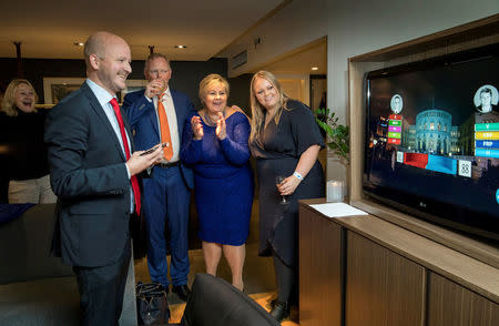 Norway's Prime Minister Erna Solberg, her daughter Ingrid Solberg Finnes and Sgbjorn Aanes, Solberg's advisor react on the good results of Solberg's Conservative party Hoyre in Oslo, Norway September 11, 2017. NTB Scanpix/Hans Kristian Thorbjornsen via REUTERS