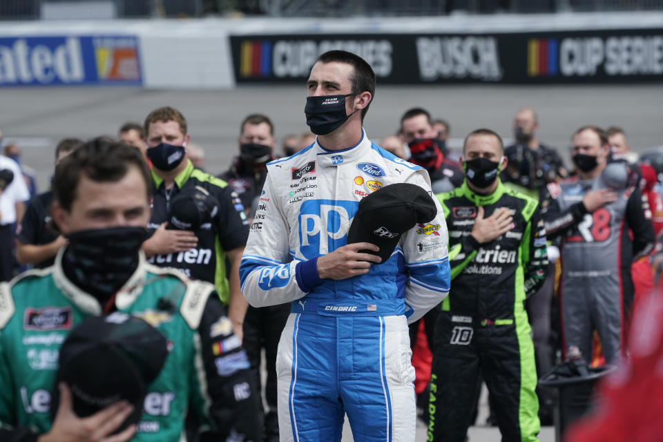 CORRECTS DATE TO SEPT. 12-Austin Cindric (22) puts his hat to his heart during the National anthem prior to the start of a NASCAR Xfinity Series auto race Saturday, Sept. 1, 2020, in Richmond, Va. (AP Photo/Steve Helber)