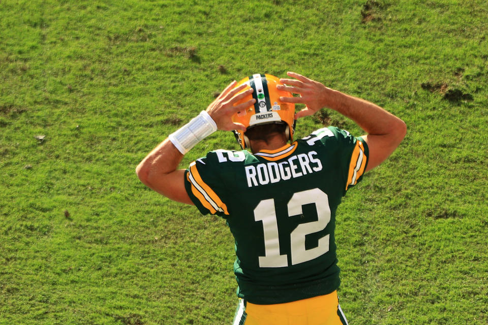 Aaron Rodgers dances in the end zone.