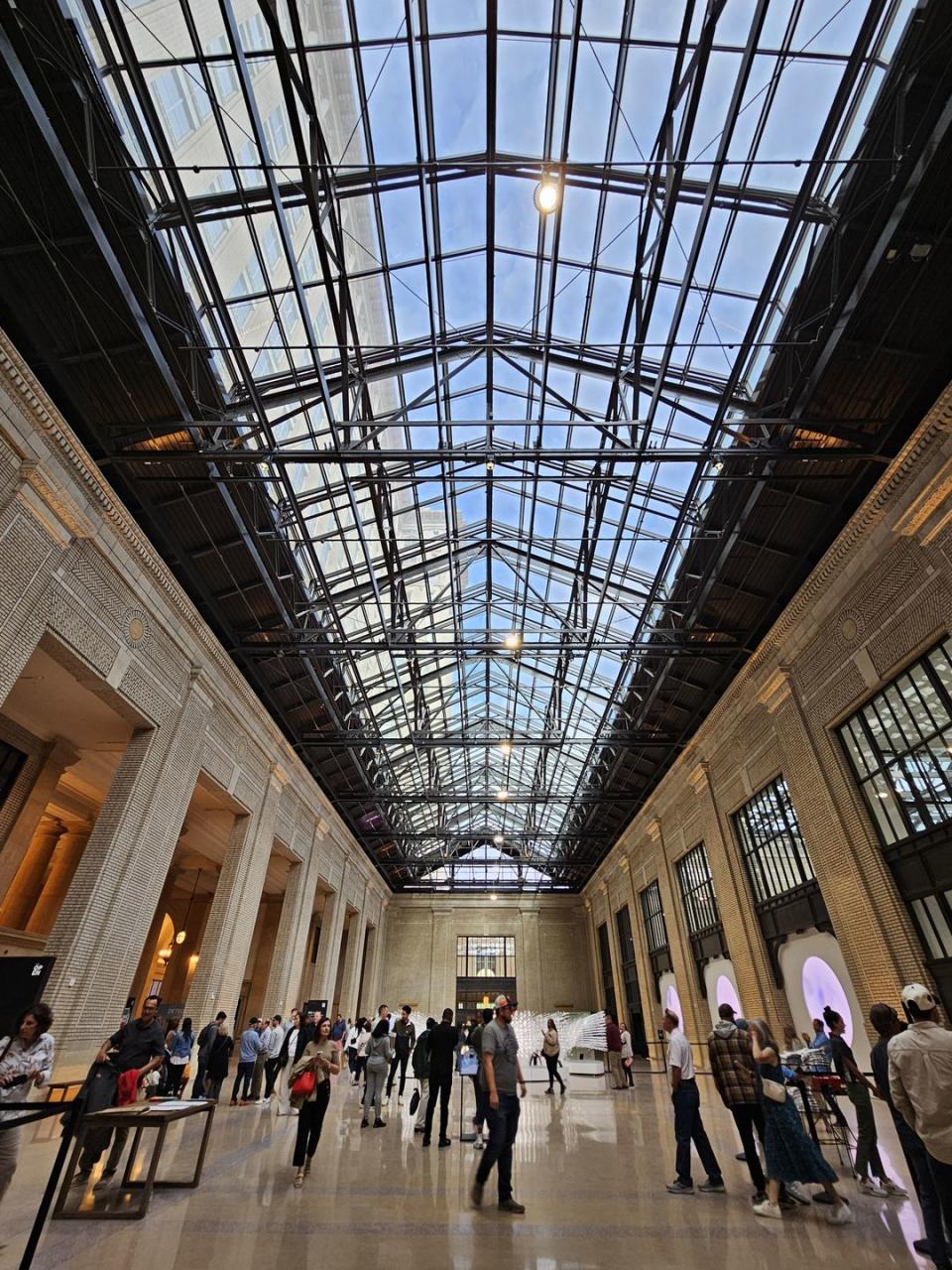 a large glass ceiling with many people