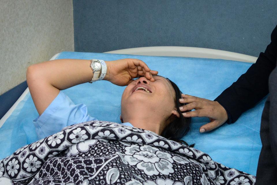 An unidentified South Korean woman who was wounded in a deadly explosion Sunday near the Egyptian border crossing with Israel at Taba, is comforted at a hospital in Sharm el Sheikh, Egypt, Monday, Feb. 17, 2014. An explosion tore through a bus filled with South Korean sightseers in the Sinai Peninsula on Sunday, killing at least four people and raising fears that Islamic militants have renewed a bloody campaign to wreck Egypt’s tourism industry. (AP Photo)