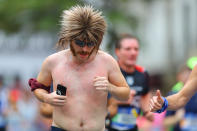 <p>A runner sports a interesting hairstyle during the 2017 New York City Marathon, Nov. 5, 2017. (Photo: Gordon Donovan/Yahoo News) </p>