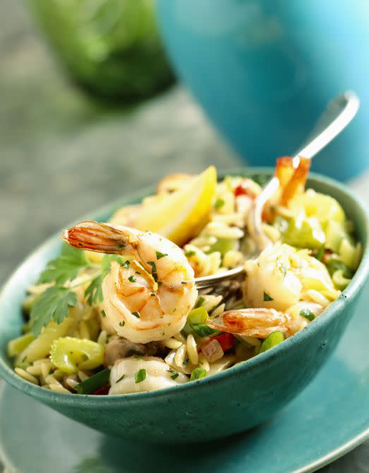 <p>Orzo feels a bit lighter than larger pastas, and is delicious served hot or cold. Succulent shrimp and summer vegetables make this dish feel especially fresh.<br></p><p><strong>Get the recipe at <a rel="nofollow noopener" href="http://www.countryliving.com/food-drinks/recipes/a5426/summer-orzo-shrimp-recipe-clx0714/" target="_blank" data-ylk="slk:Country Living;elm:context_link;itc:0;sec:content-canvas" class="link ">Country Living</a>. </strong></p>