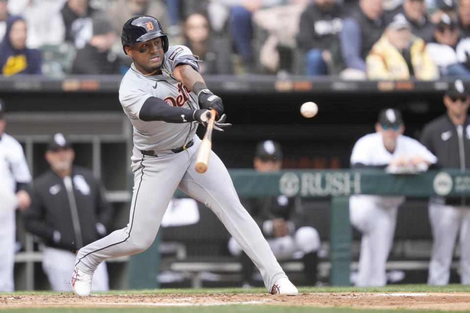 Detroit Tigers' Andy Ibanez hits an RBI sacrifice fly off Chicago White Sox's Garrett Crochet during the third inning of the White Sox's home opener baseball game Thursday, March 28, 2024, in Chicago. Javier Baez scored on the play. (AP Photo/Charles Rex Arbogast)