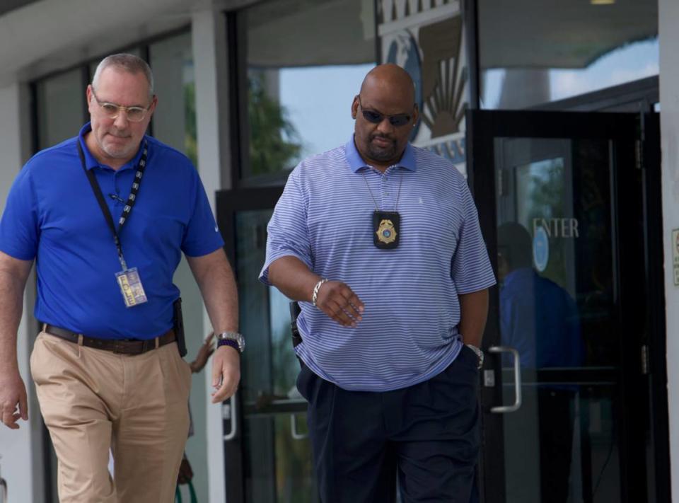 Two Florida Department of Law Enforcement agents leave Miami City Hall in Miami, Florida, on Thrusday, Sept. 14, 2023. Miami Commissioner Alex Díaz de la Portilla was arrested on a host of corruption charges that include bribery and money laundering, according to the FDLE.