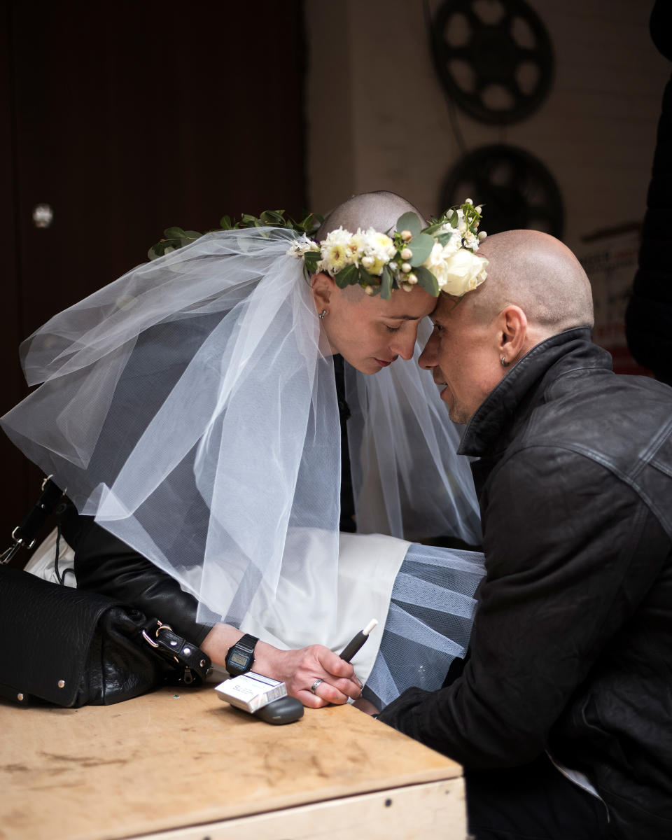 Volunteer doctors Anastsia Hraczow and Anton Sokolow marry in Kharkiv, Ukraine on April 3, 2022. During the reception, Ukrainian poet Serhiy Zhadan described the couple as "strong and brave young people whose love resist the dark reality around."<span class="copyright">Agata Grzybowska</span>