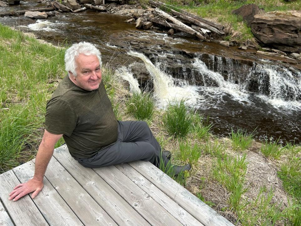 Tom Hickie says at first he was against removing the dam but was resigned to the fact that it had deteriorated beyond repair and had to go. Now, in spite of the current issues, he says he's generally happy to have a naturally flowing brook in his backyard.  