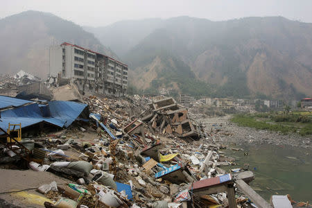 Ruins of a destroyed old city district and a landslide are seen in the earthquake-hit Beichuan county, Sichuan province, China, May 16, 2008. REUTERS/Jason Lee/File Photo