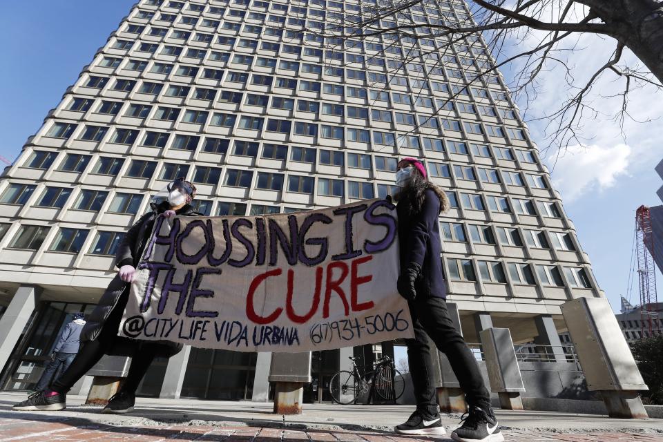 FILE - In this Jan. 13, 2021, file photo tenants' rights advocates demonstrate outside the JFK federal building in Boston. The protest was part of a national day of action calling on the incoming Biden administration to extend the eviction moratorium initiated in response to the Covid-19 pandemic. A federal judge ruled ruled Wednesday, May 5, that the Centers for Disease Control and Prevention exceeded its authority when it imposed a federal eviction moratorium. (AP Photo/Michael Dwyer, File)