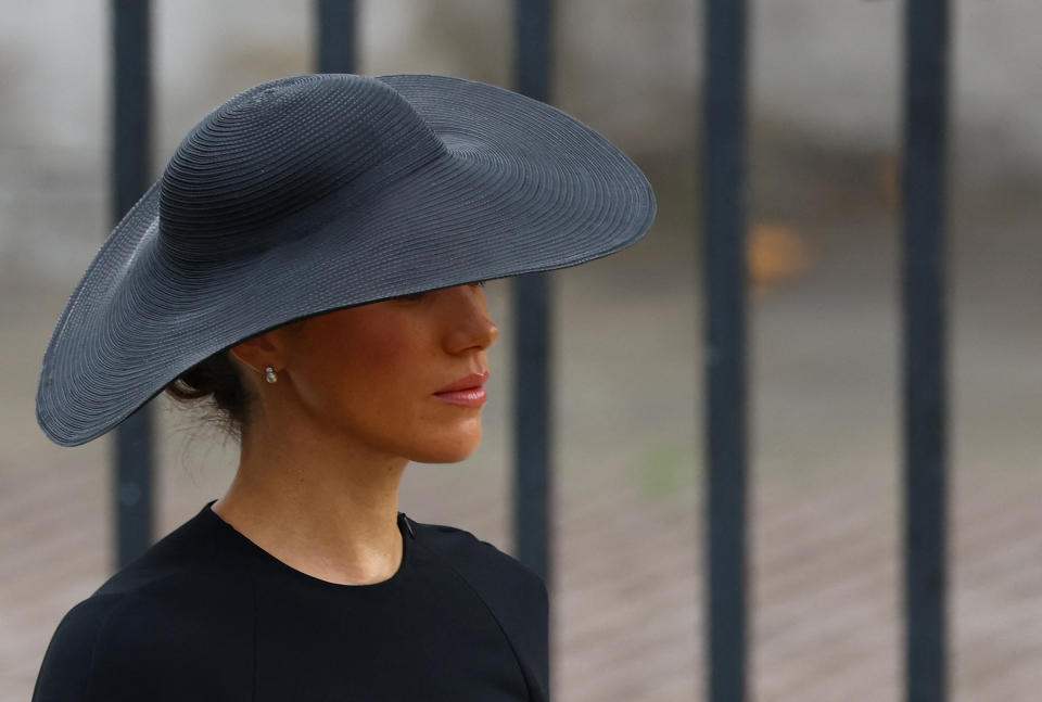 <p>Britain's Meghan, Duchess of Sussex arrive ahead of the State Funeral of Queen Elizabeth II at Westminster Abbey in London on Sept. 19, 2022. Leaders from around the world will attend the state funeral of Queen Elizabeth II. The country's longest-serving monarch, who died aged 96 after 70 years on the throne, will be honoured with a state funeral on Monday morning at Westminster Abbey. (Photo by Hannah McKay/Pool/AFP via Getty Images)</p> 