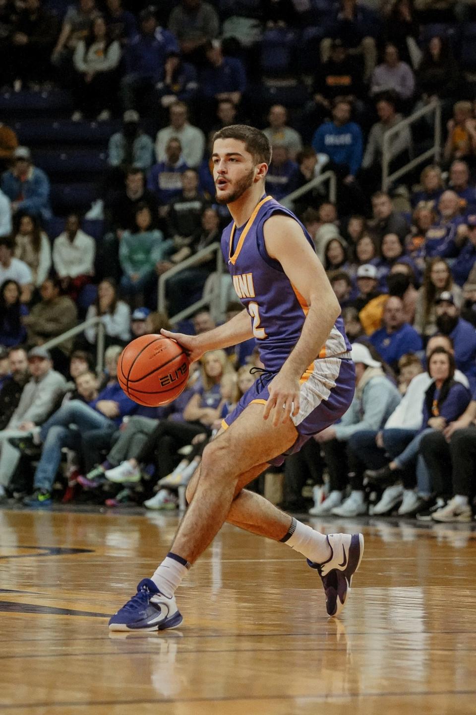 Ege Peksari dribbles the ball during a UNI basketball game. The Panthers' freshman wished he could do more to help in the wake of the earthquakes in Turkey.