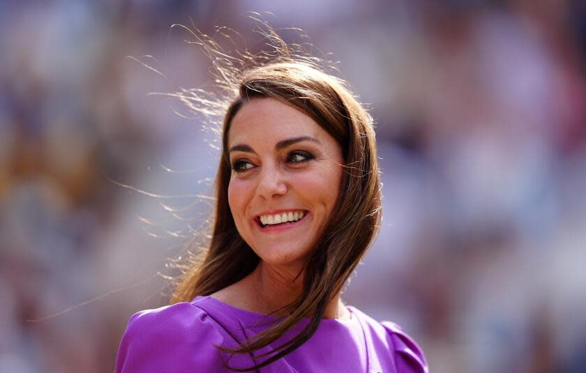 The Princess of Wales smiles in an electric purple dress at the 2024 Wimbledon Singles final trophy presentation