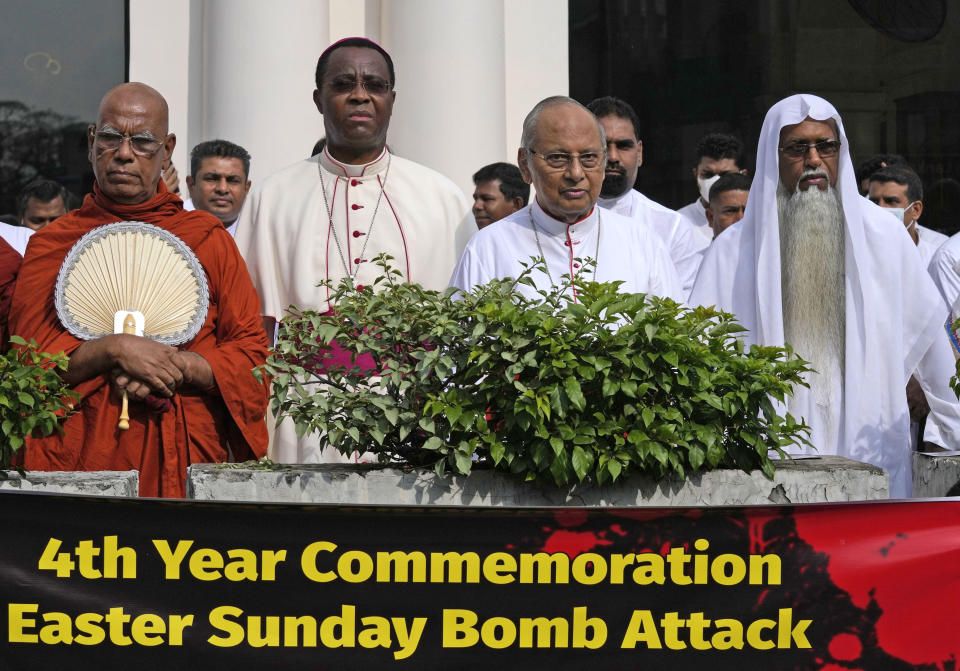 Cardinal Malcolm Ranjith, second right, archbishop of Colombo, stands in silence with other religious leaders during a silent protest to mark the fourth year commemoration of the 2019, Easter Sunday bomb attacks on Catholic Churches, in Colombo, Sri Lanka, Friday, April 21, 2023. Thousands of Sri Lankans held a protest in the capital on Friday, demanding justice for the victims of the 2019 Easter Sunday bomb attacks that killed nearly 270 people. (AP Photo/Eranga Jayawardena)