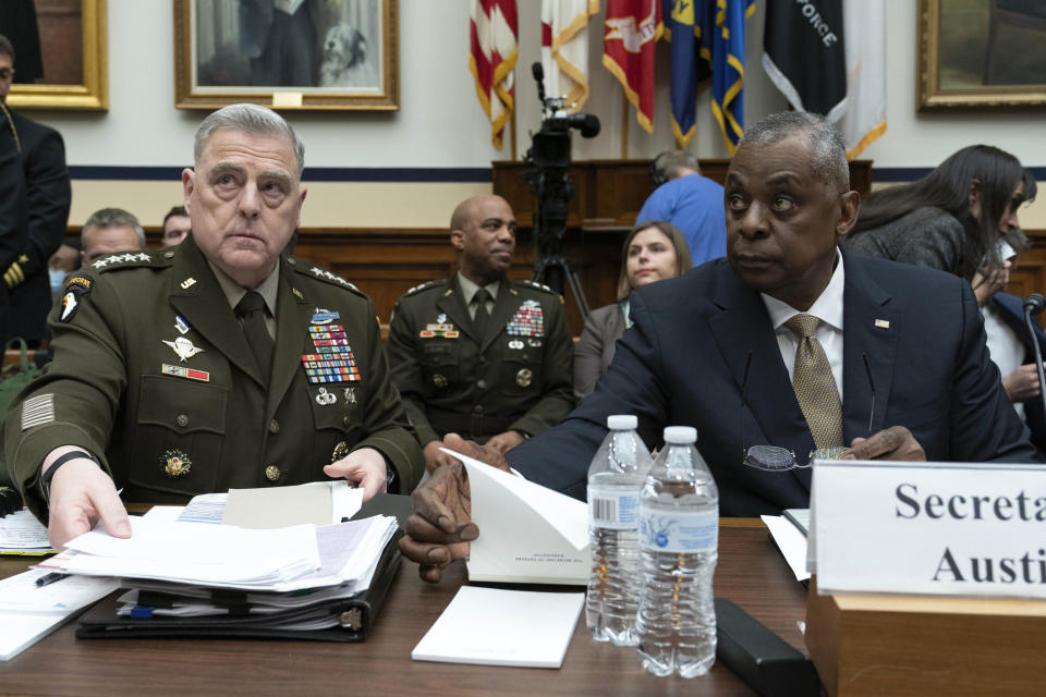 Chairman of the Joint Chiefs of Staff Gen. Mark Milley, accompanied by Secretary of Defense Lloyd Austin, testifies before the House Armed Services Committee on the fiscal year 2024 budget request of the Department of Defense, on Capitol Hill in Washington, Wednesday, March 29, 2023. (AP Photo/Jose Luis Magana)
