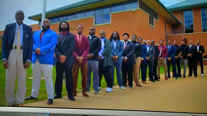 A Twitter post earlier this month from Cardinal Ritter College Prep High School in St. Louis featured the above picture of its 18 Black male teachers and administrators. (Photo: Screenshot/YouTube.com)