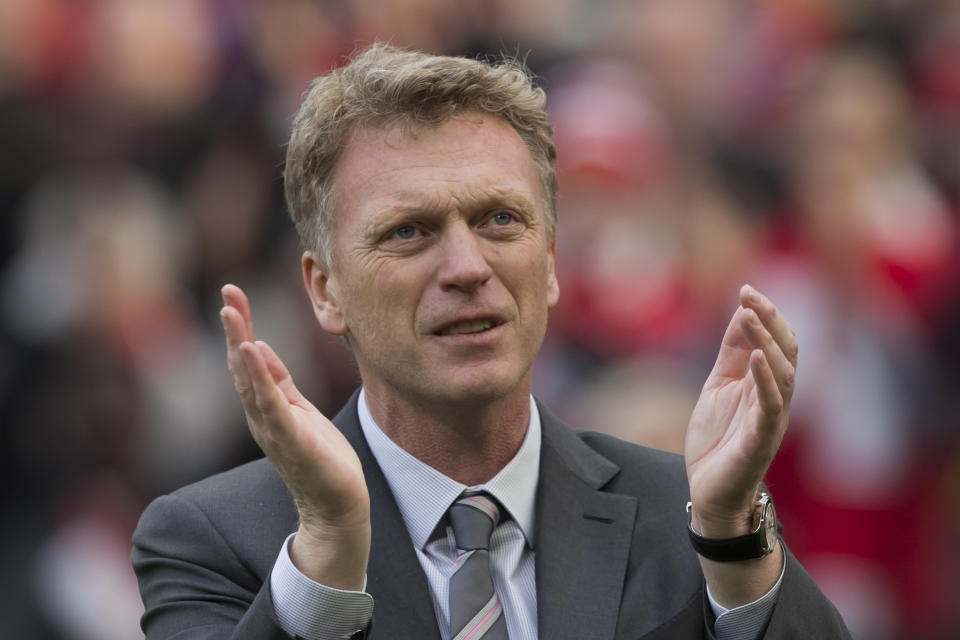 Manchester United's manager David Moyes applauds supporters after his team's 4-1 win against Aston Villa in their English Premier League soccer match at Old Trafford Stadium, Manchester, England, Saturday March 29, 2014. (AP Photo/Jon Super)