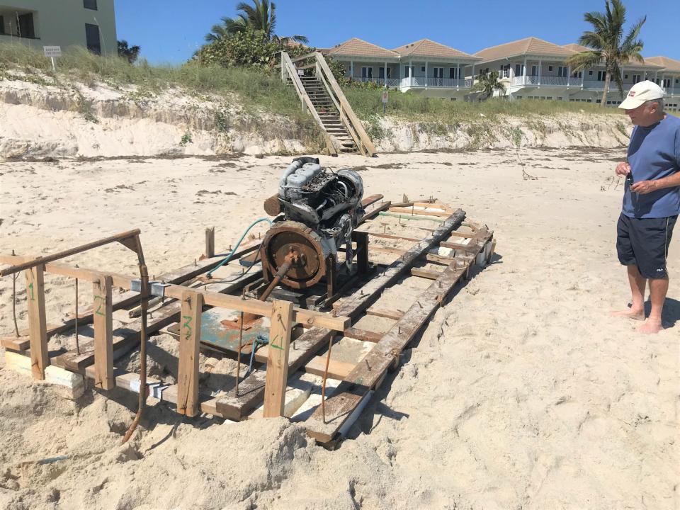 Beachgoers  like Don Dykes, a 12-year seasonal Vero Beach resident, on Thursday Oct. 6, 2022, stopped to examine a makeshift vessel after it appeared on shore north of Jaycee Beach Park in Vero Beach early Wednesday Oct. 5.