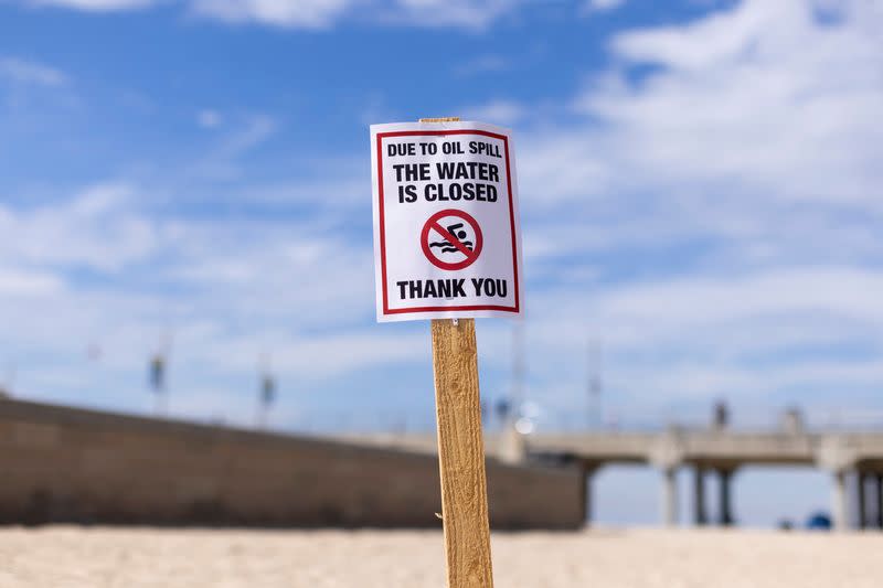 FILE PHOTO: California oil spill comes ashore in Huntington Beach