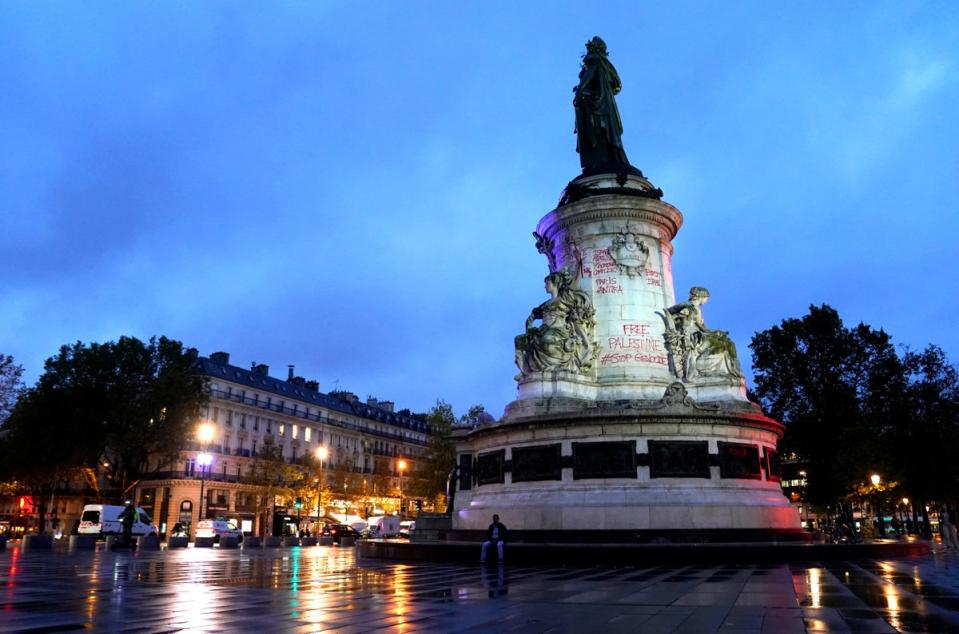 Graffiti reading Free Palestine is seen on the side of the Monument à la Republique at the Place de la Republique in Paris following pro-Palestinian protests (PA)