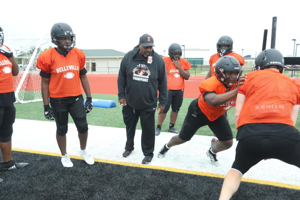 Belleville line coach Will McMichael  works with the players during practice Tuesday, August 15, 2023.