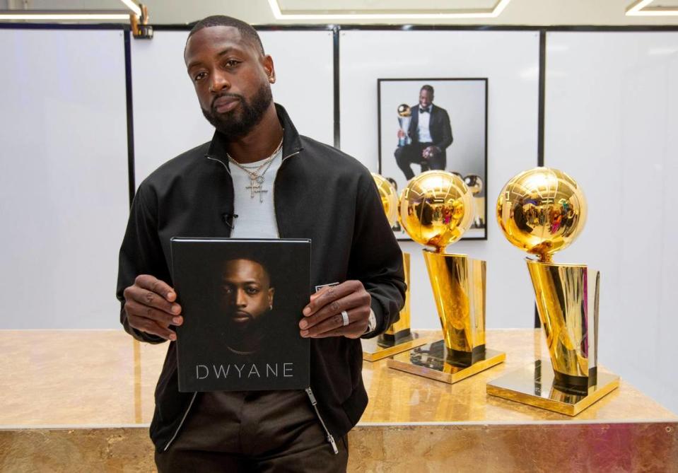 Miami Heat legend Dwyane Wade speaks to an audience during a moderated discussion for his new memoir “Dwyane.” at The Shop in Pop Up Shop Miami in the Wynwood neighborhood of Miami, Florida, on Friday, November 19, 2021.