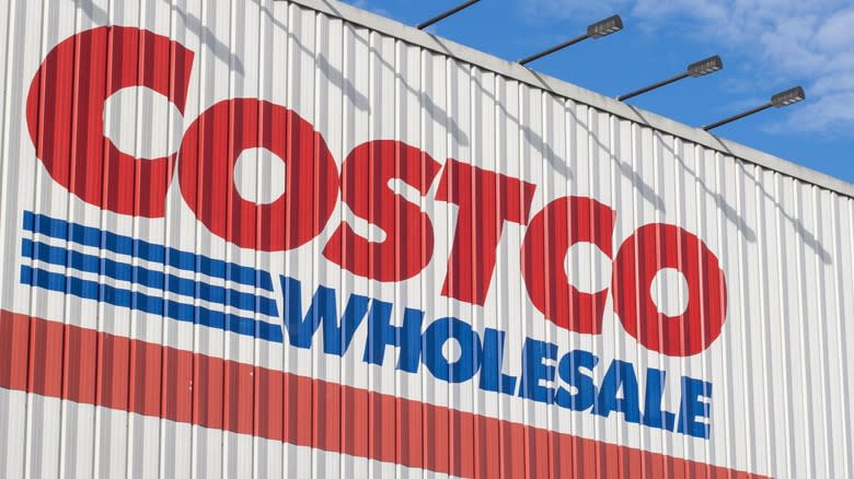 The Costco logo on the side of a store in daytime