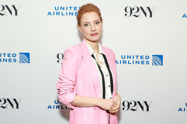 Jessica Chastain matches her lips to her hot pink designer bag in