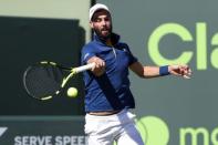 Mar 23, 2018; Key Biscayne, FL, USA; Benoit Paire of France hits a forehand against Novak Djokovic of Serbia (not pictured) on day four of the Miami Open at Tennis Center at Crandon Park. Paire won 6-3, 6-4. Mandatory Credit: Geoff Burke-USA TODAY Sports