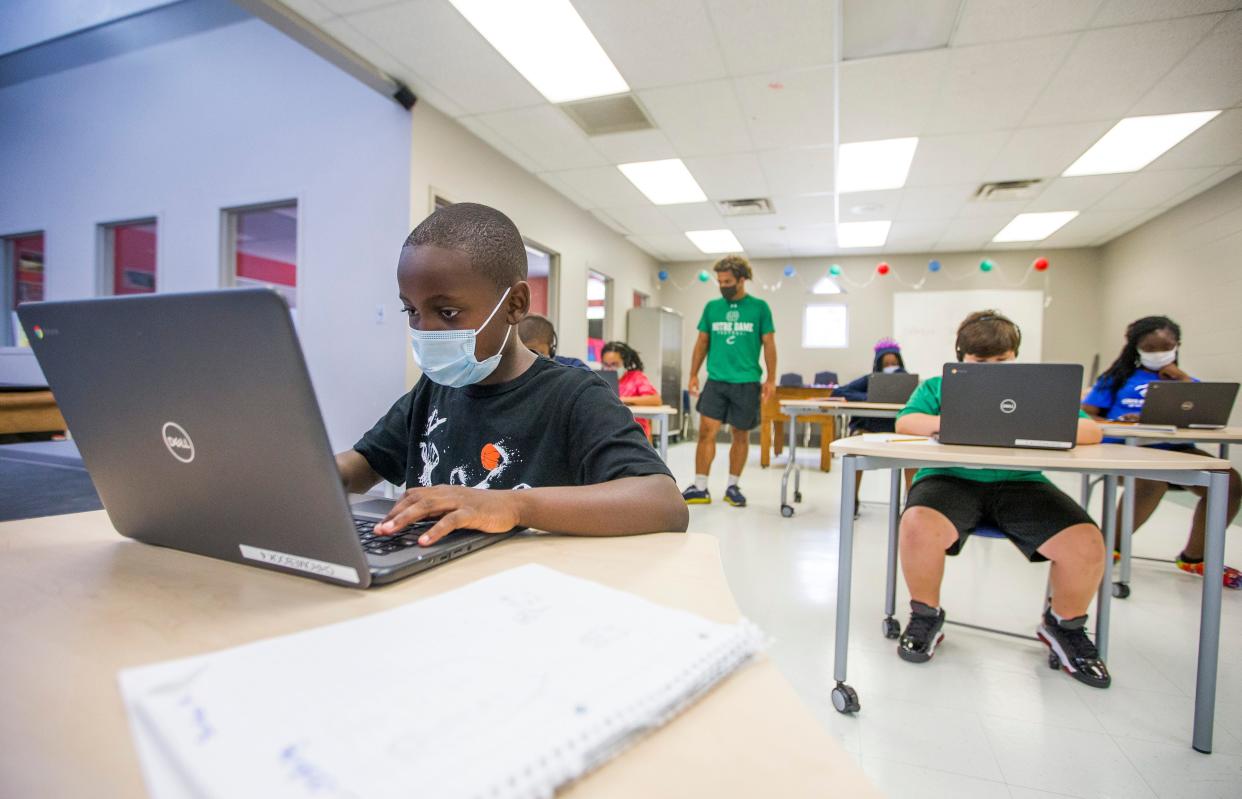 Kennedy Primary Center fourth grader Jonathan Giden, 9, left, uses a computer inside the Boys & Girls Club of St. Joseph County on Wednesday, Aug. 5, 2020, in South Bend.