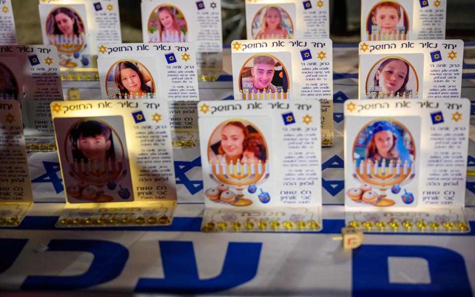 Individual hanukkiah's featuring the released, and non-released, faces of hostages are displayed outside The Museum of Art