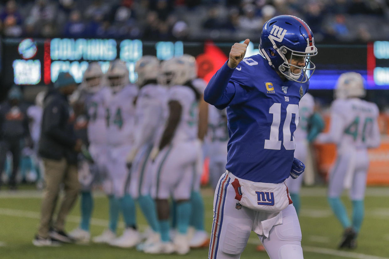 New York Giants quarterback Eli Manning (10) runs off the field during the fourth quarter of an NFL football game against the Miami Dolphins, Sunday, Dec. 15, 2019, in East Rutherford, N.J. (AP Photo/Seth Wenig)