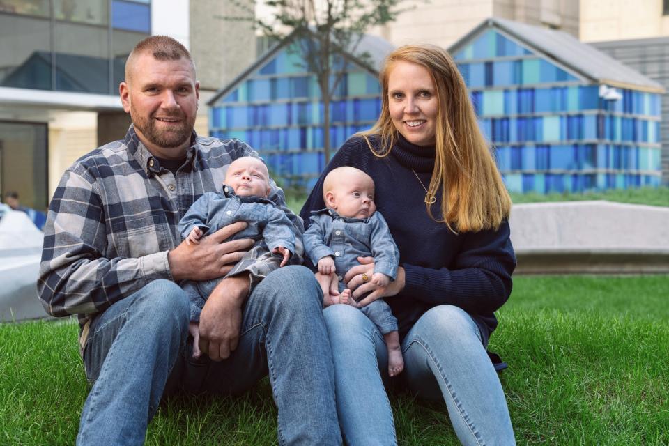 Shannon Hogan and her boyfriend Mike Staples of Whitman hold their twins Luke and Liam Staples, who turned 10 months old on April 6, 2024. The twins underwent successful surgery to correct twin-twin transfusion syndrome (TTTS), which is when one twin receives too much blood flow and the other too little while in utero due to an imbalance in the placenta's blood vessels.