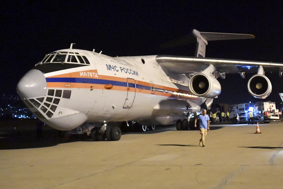 FILE - In this photo provided by Russian Emergency Situations Ministry press service, boxes of Russian aid supplies arrive on a Russian cargo plane after a massive explosion at the port, in Beirut, Lebanon, Aug. 5, 2020. Russia's invasion of Ukraine has brought up deep divisions in the Middle East. While American influence has waned, Russia has made powerful friends, from Shiite militias in Iraq, to Lebanon’s Hezbollah group, to Houthi rebels in Yemen These non-state actors want their countries to come out firmly in support of Russia. In Lebanon, the foreign minister had to walk back a strong condemnation of Russia's invasion. (AP Photo/Ministry of Emergency Situations press service via AP, File)