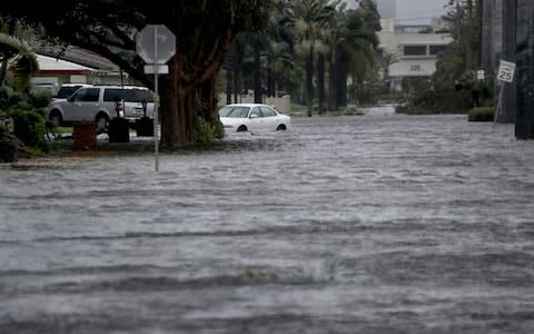 Floodwaters cover part of 3rd Ave in Dania Beach, east of U.S. Route 1, Florida - Credit: AP