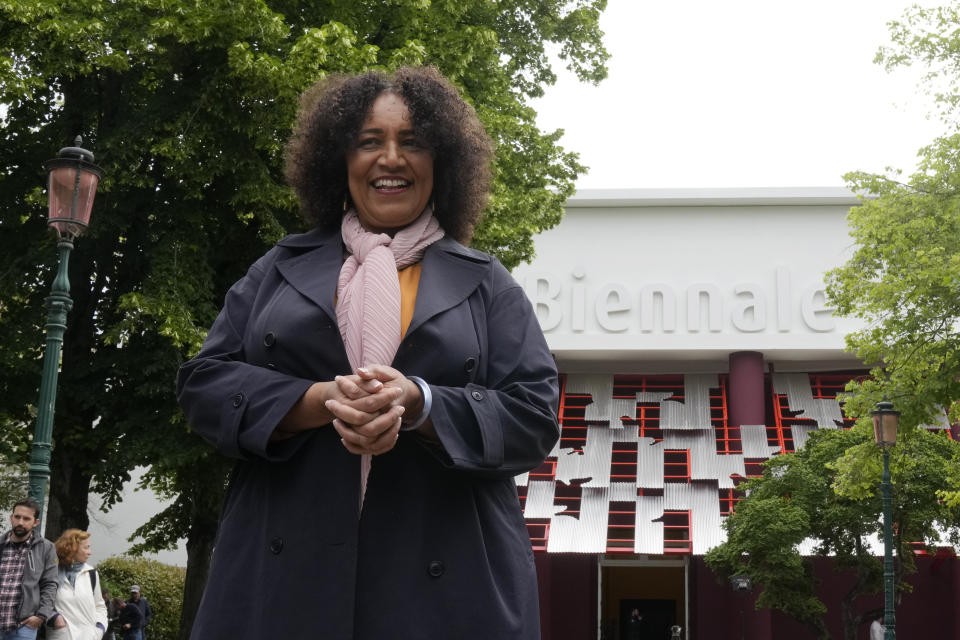 Lesley Lokko, a Scottish-Ghanian who is the first African to curate the architectural Biennale poses for photographers, at the Biennale International Architecture exhibition, in Venice, Italy, Wednesday, May 17, 2023. The 18th edition of the Biennale International Architecture exhibition will open to the public from Saturday May 20 to Sunday Nov. 26, 2023. (AP Photo/Antonio Calanni)