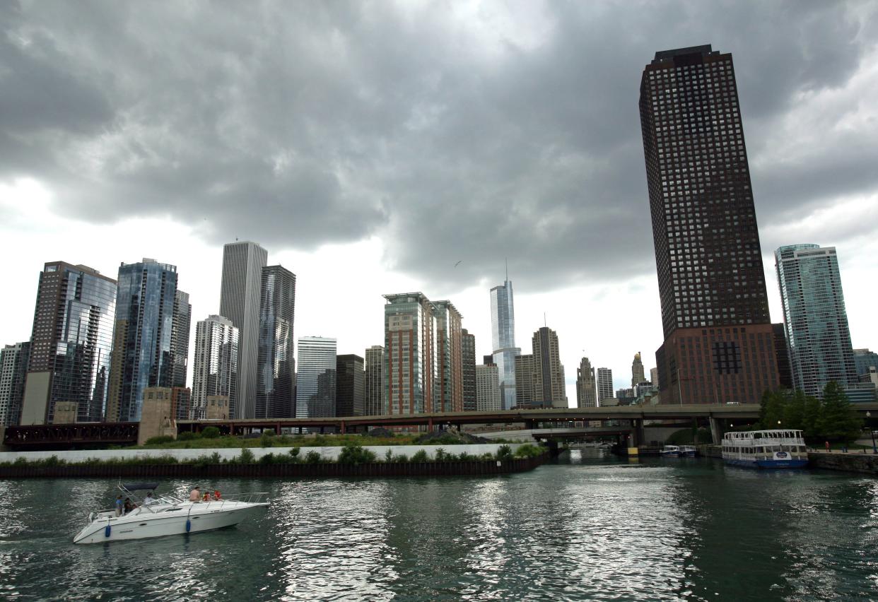 A recreational boater glides along the Chicago River. In the 1800s, the city reversed the flow of the river so its sewage would no longer flow into Lake Michigan and contaminate its drinking water. Last month, Chicago struck a deal to sell Lake Michigan water to nearby Joliet.