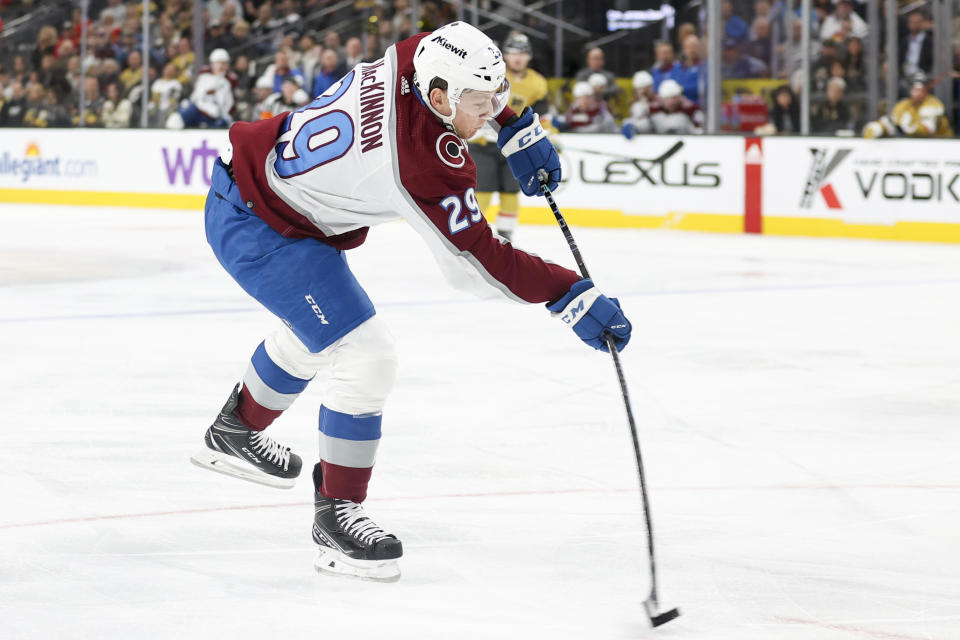 Colorado Avalanche center Nathan MacKinnon shoots during the first period of an NHL hockey game against the Vegas Golden Knights Saturday, Nov. 4, 2023, in Las Vegas. (AP Photo/Ian Maule)