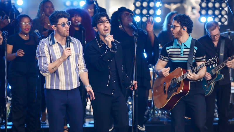 Nick Jonas, from left, Joe Jonas and Kevin Jonas of the Jonas Brothers perform on NBC's "Today" show at Rockefeller Plaza on Friday, May 12, 2023, in New York. The Jonas Brothers will perform at the Stadium of Fire in Provo, Utah, this year.