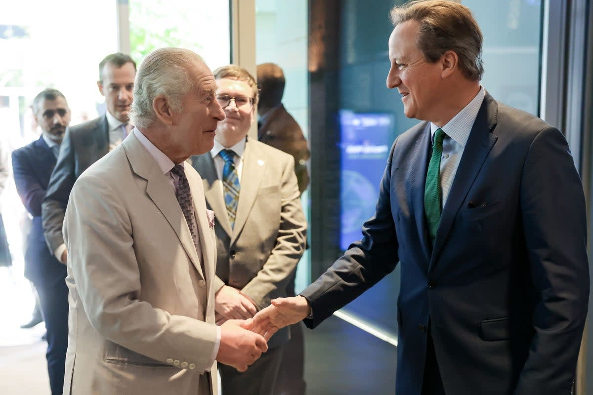 King Charles III greets Foreign Secretary Lord Cameron on Thursday during a visit to the Heriot-Watt University's new Dubai campus  (Getty Images)