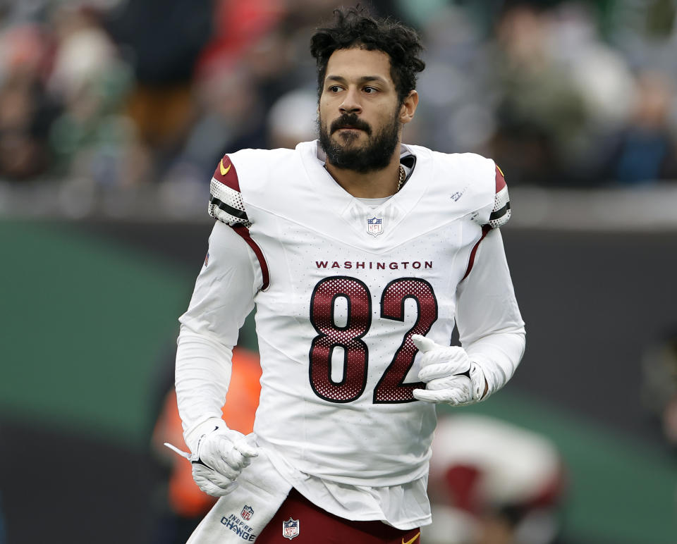 FILE - Washington Commanders tight end Logan Thomas walks off the field during halftime of an NFL football game against the New York Jets, Dec. 24, 2023, in East Rutherford, N.J. The Commanders have released Thomas, who turns 33 this summer. Thomas' release saves the team over $5 million in salary cap space. The converted college quarterback spent the past four seasons with Washington. (AP Photo/Adam Hunger, File)