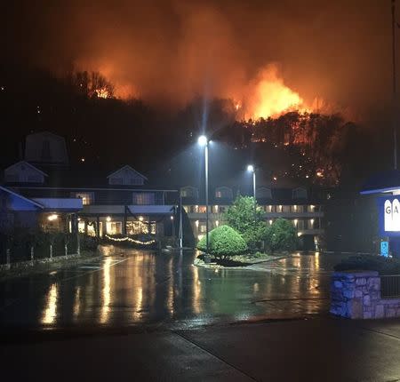 A wildfire burns on a hillside after a mandatory evacuation was ordered in Gatlinburg, Tennessee in a picture released November 30, 2016. Tennessee Highway Patrol/Handout via REUTERS