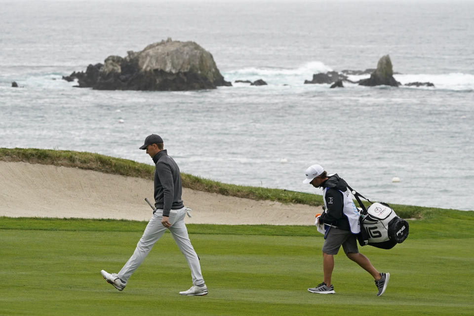 Jordan Spieth walks up the fourth fairway of the Pebble Beach Golf Links during the final round of the AT&T Pebble Beach Pro-Am golf tournament Sunday, Feb. 14, 2021, in Pebble Beach, Calif. (AP Photo/Eric Risberg)