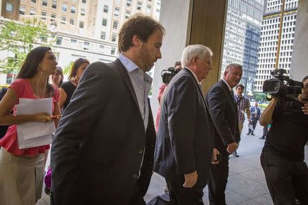 Argentina's Economy Ministry's Legal and Technical Secretary Federico Thea (2nd L) arrives at the office of a court-appointed mediator for a meeting on Argentina's dispute with holdout investors over its sovereign debt, in New York July 11, 2014. REUTERS/Brendan McDermid