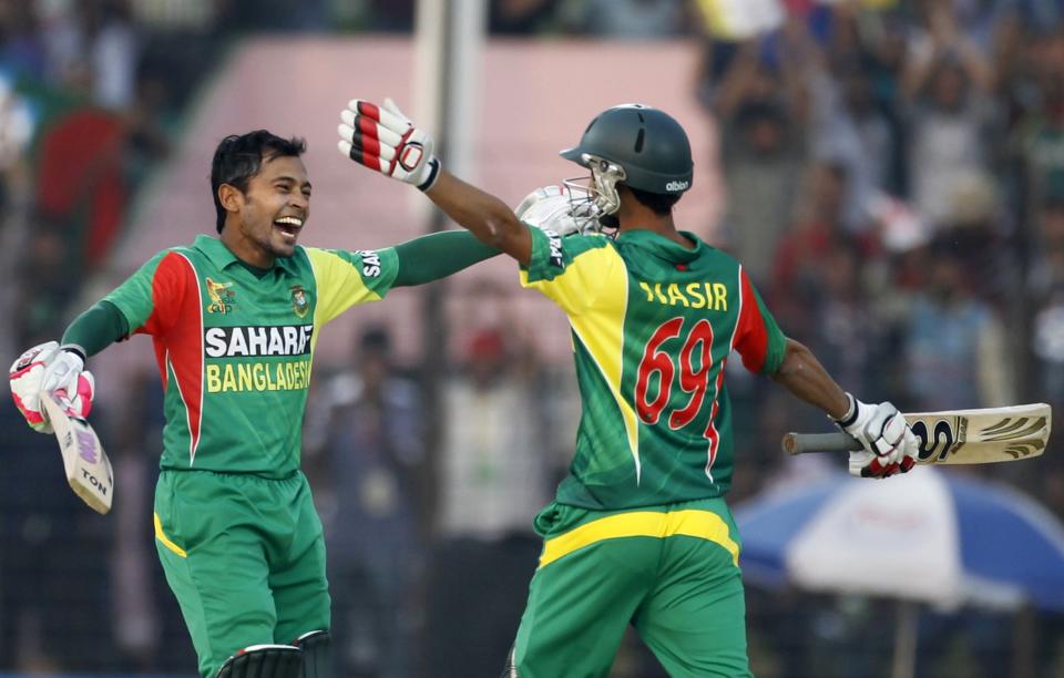 Bangladesh's Nasir Hossain (R) congratulates captain Mushfiqur Rahim for scoring a century against India during their Asia Cup 2014 one-day international (ODI) cricket match in Fatullah February 26, 2014.